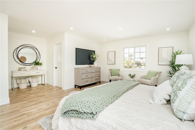 bedroom with recessed lighting, baseboards, and wood finished floors