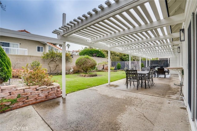 view of patio / terrace with outdoor dining area, a fenced backyard, and a pergola