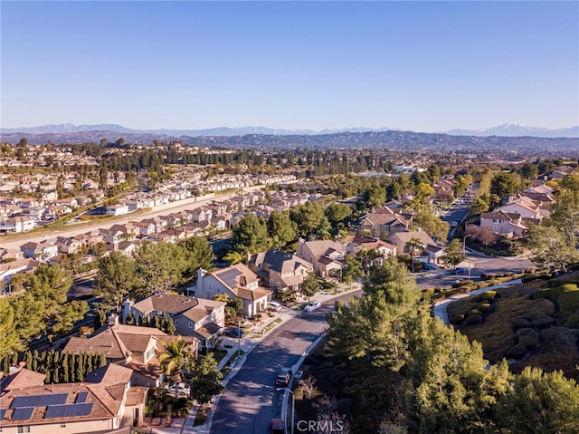 drone / aerial view featuring a residential view and a mountain view