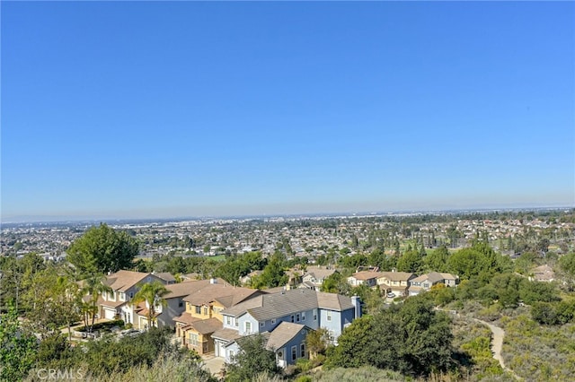 birds eye view of property with a residential view