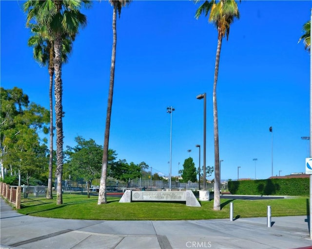 surrounding community featuring a yard