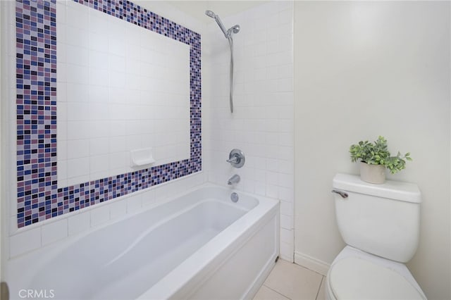 bathroom featuring tile patterned floors, baseboards, toilet, and bathing tub / shower combination