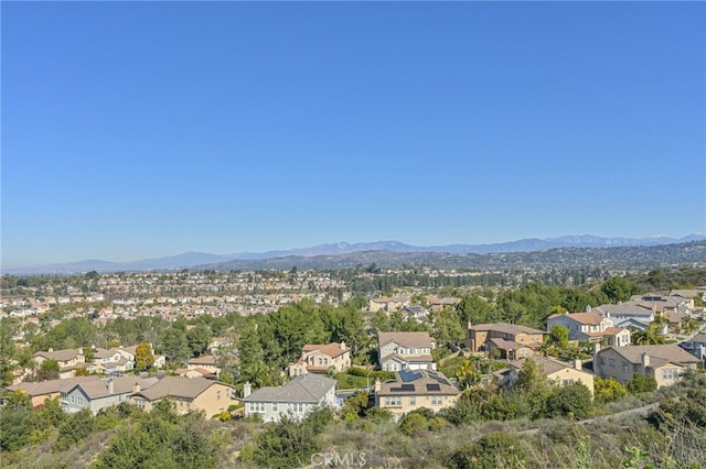 drone / aerial view with a residential view and a mountain view