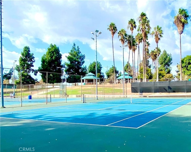 view of sport court with community basketball court and fence