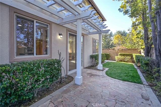 view of patio with fence and a pergola