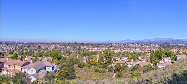 birds eye view of property with a mountain view and a residential view