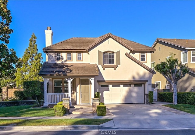 mediterranean / spanish-style home featuring a porch, an attached garage, stucco siding, a chimney, and concrete driveway