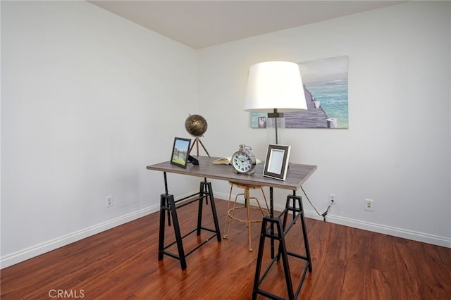 office with wood finished floors and baseboards