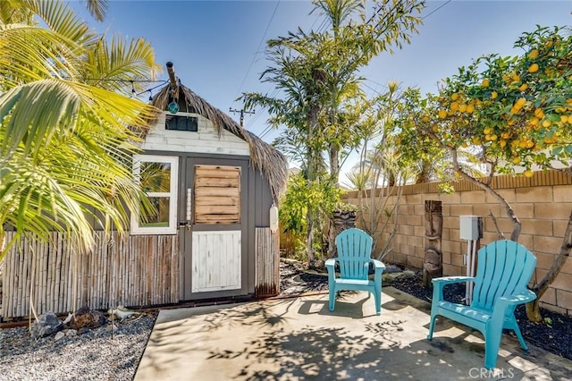 view of shed with fence