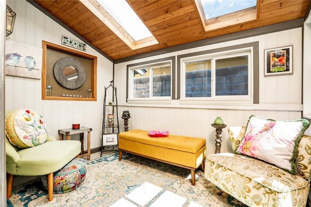 sitting room with lofted ceiling with skylight and wood ceiling