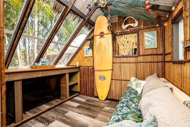 interior space featuring wood finished floors and wood walls