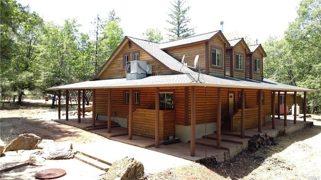 exterior space featuring faux log siding