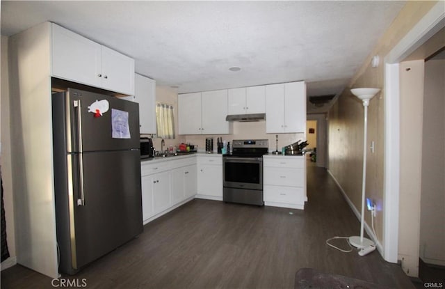 kitchen featuring under cabinet range hood, dark wood-style floors, freestanding refrigerator, stainless steel electric range, and white cabinets