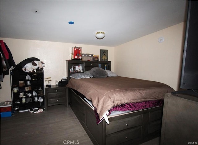 bedroom featuring wood finished floors