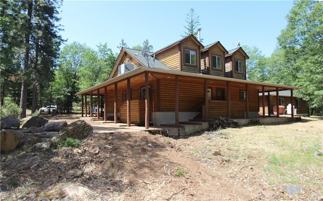 view of front facade with faux log siding