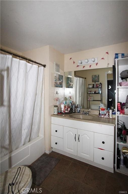 bathroom with vanity and shower / bath combo