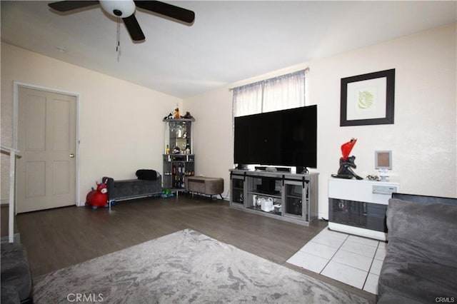 living area with wood finished floors and ceiling fan