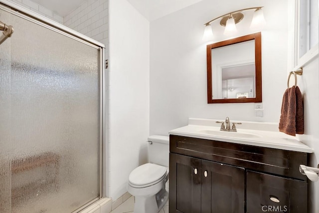 full bath with vanity, toilet, and a stall shower