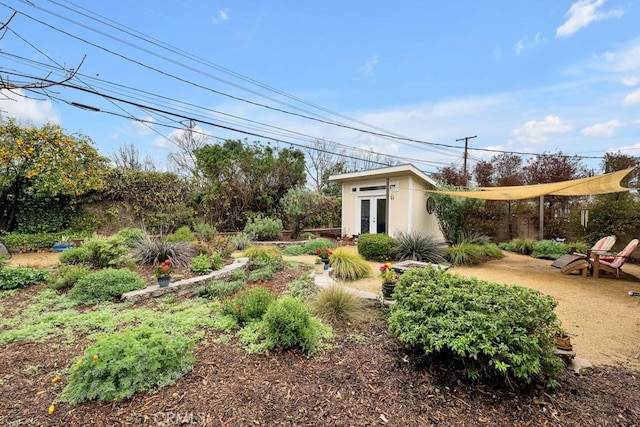 view of yard with french doors