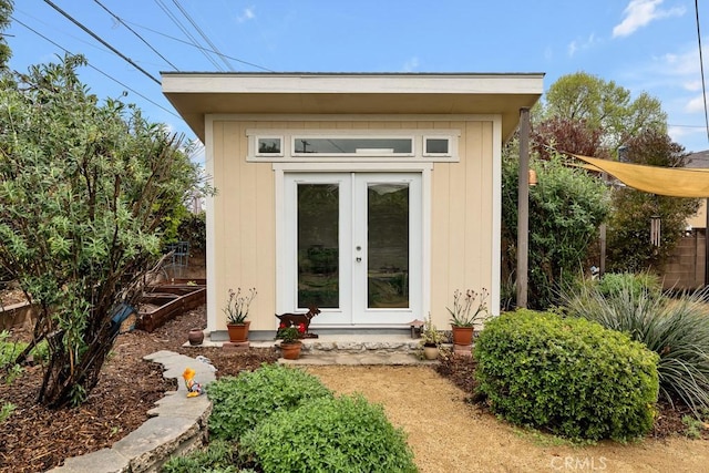 view of outbuilding featuring french doors and an outdoor structure