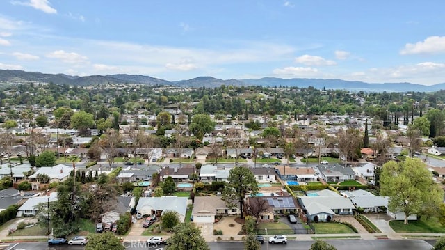 drone / aerial view with a residential view and a mountain view