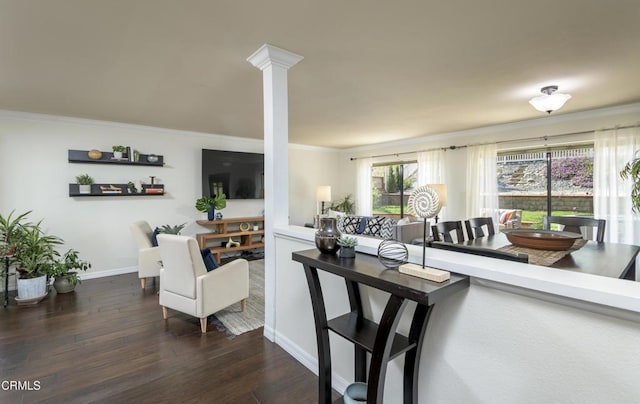 dining area with decorative columns, baseboards, dark wood-style flooring, and ornamental molding