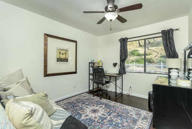 office area with baseboards, a ceiling fan, and wood finished floors