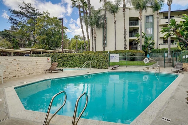 pool featuring fence