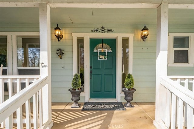 property entrance featuring a porch