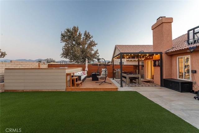 view of yard with fence and a wooden deck