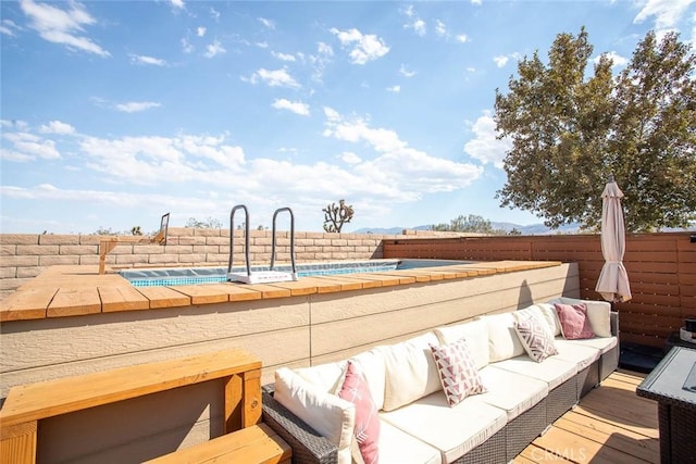 wooden deck featuring an outdoor living space