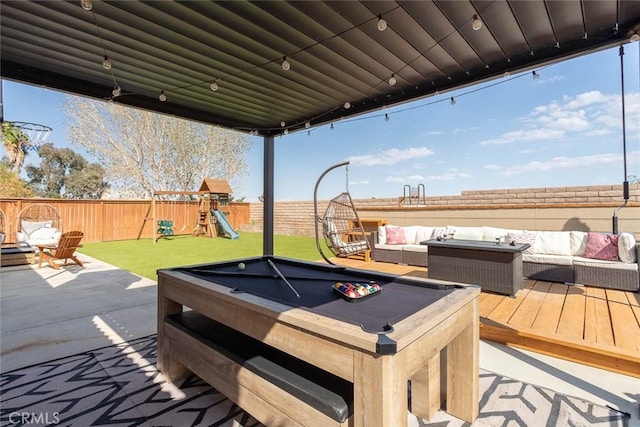 deck featuring a lawn, a fenced backyard, a playground, outdoor lounge area, and a patio area