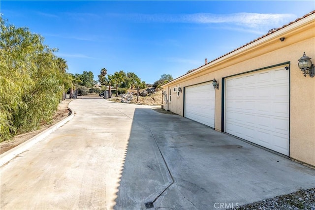 garage featuring driveway