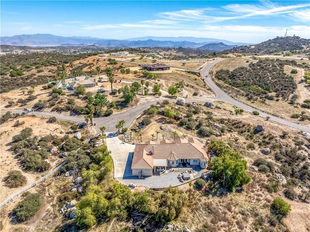 birds eye view of property with a mountain view