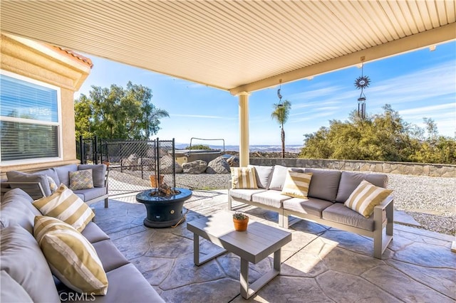 view of patio / terrace featuring outdoor lounge area and fence