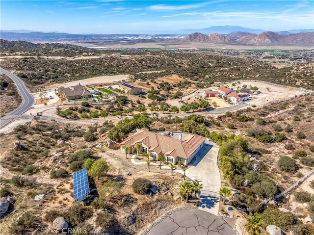 birds eye view of property with a mountain view