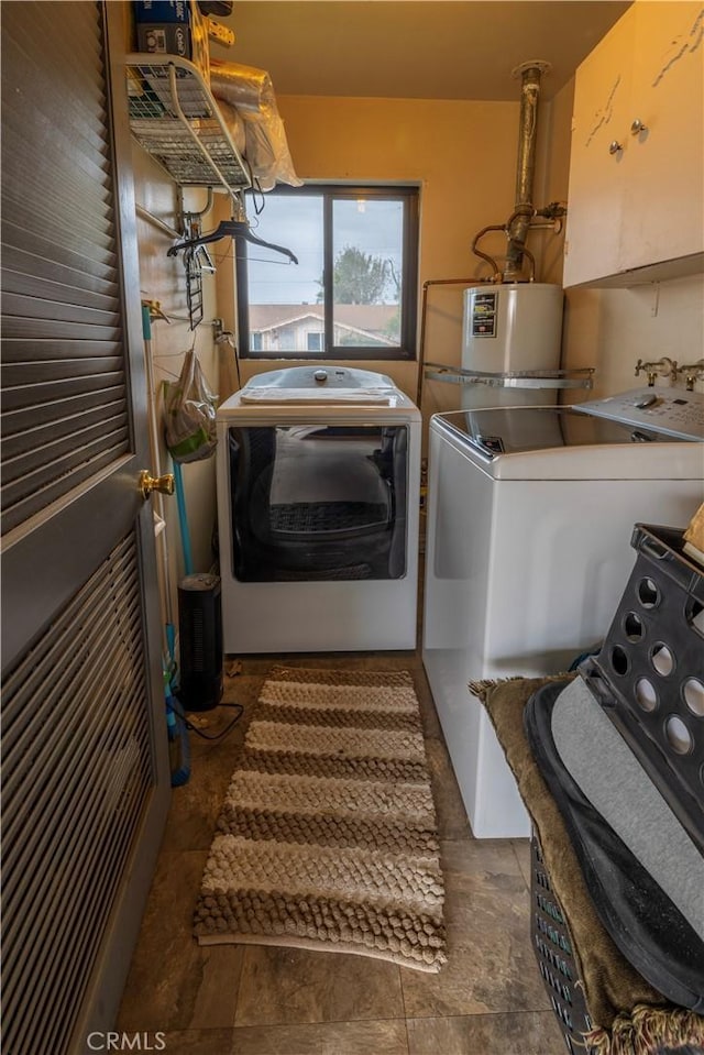 laundry room featuring gas water heater, independent washer and dryer, and laundry area