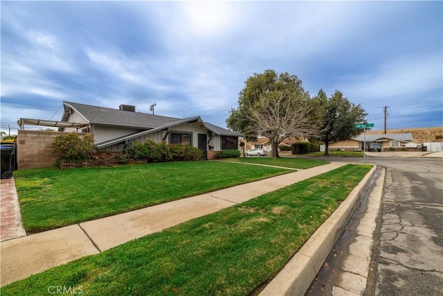 exterior space with a front yard