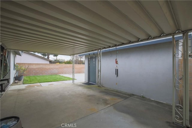 garage with fence