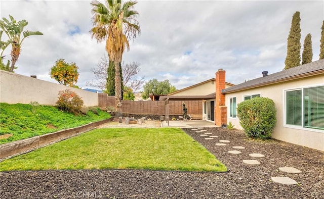 view of yard with a patio and a fenced backyard