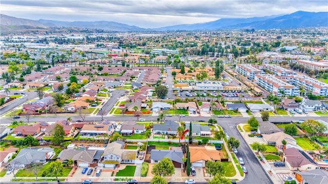 drone / aerial view with a residential view and a mountain view