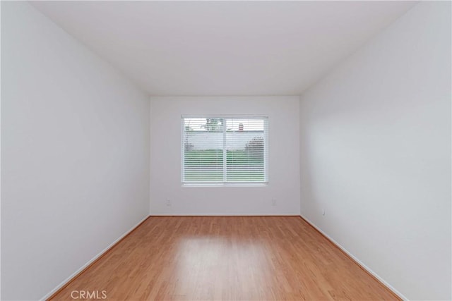 spare room with light wood finished floors