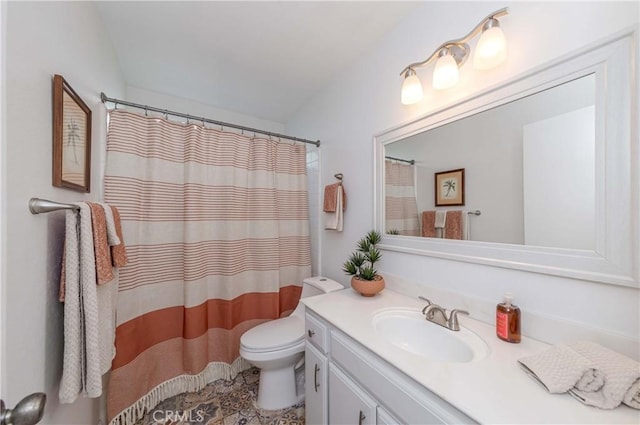 bathroom featuring toilet, curtained shower, and vanity