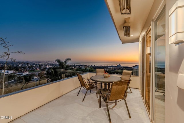 balcony at dusk with a water view