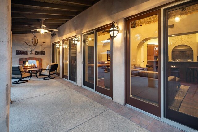 view of patio featuring a multi sided fireplace