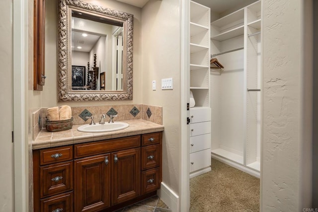 bathroom with backsplash and vanity