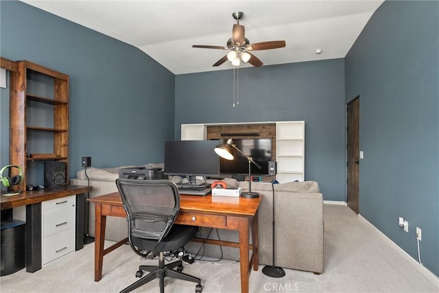 home office with vaulted ceiling, light carpet, baseboards, and ceiling fan