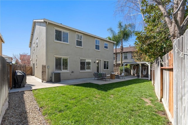 back of house with a patio, cooling unit, a yard, a fenced backyard, and stucco siding