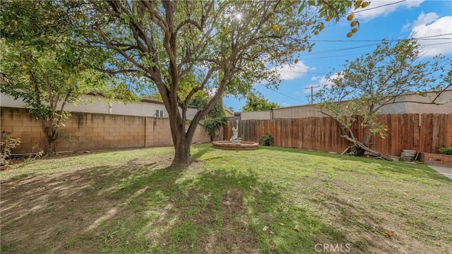 view of yard featuring a fenced backyard