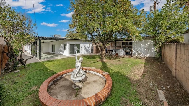 view of yard featuring a patio area and a fenced backyard